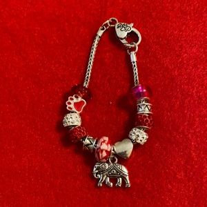 Red and white charm bracelet.